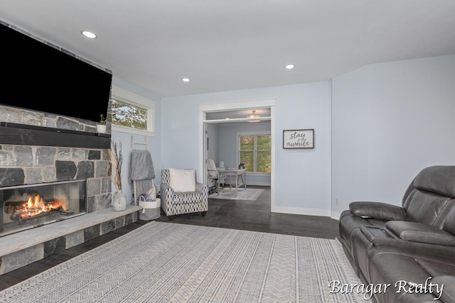 8790 Laurel Ridge Dr SE, Alto, MI 49302 - living room with plenty of natural light, recessed lighting, wood finished floors, and a fireplace