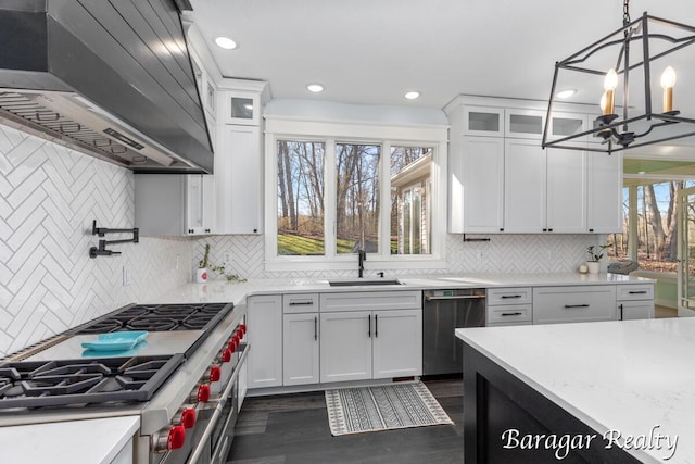 8790 Laurel Ridge Dr SE, Alto, MI 49302 - kitchen with stainless steel appliances, custom exhaust hood, a chandelier, dark wood-style floors, and white cabinetry