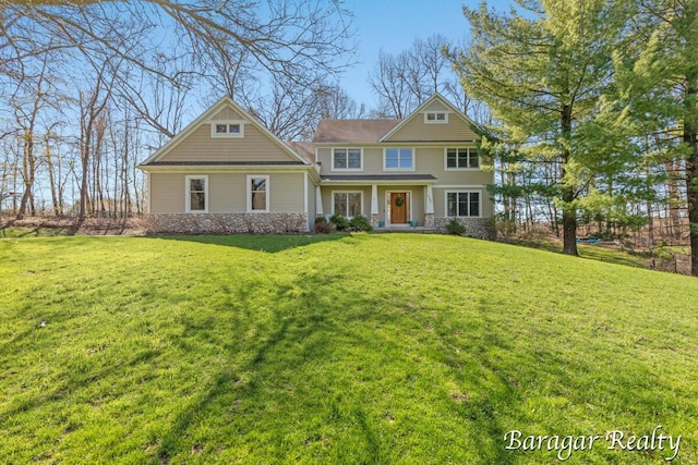 8790 Laurel Ridge Dr SE, Alto, MI 49302 - craftsman house featuring a front lawn and stone siding