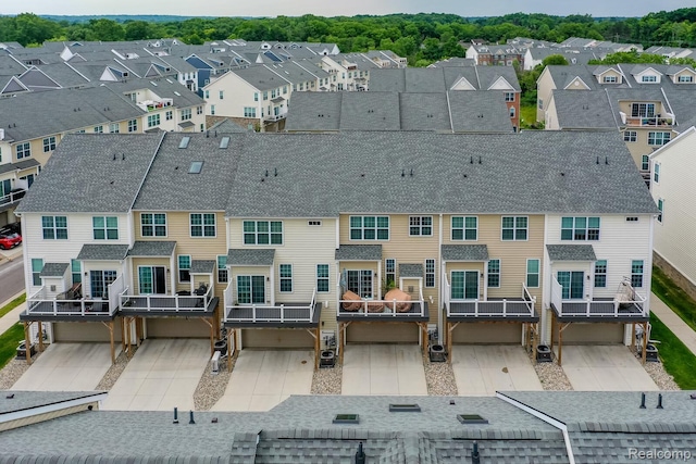 2855 Hardwick Rd, Ann Arbor, MI 48105 - back of property featuring a residential view and roof with shingles