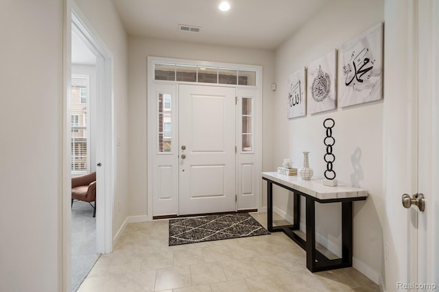 2855 Hardwick Rd, Ann Arbor, MI 48105 - entryway with baseboards and light tile patterned flooring