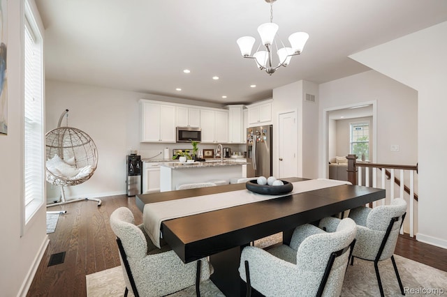 2855 Hardwick Rd, Ann Arbor, MI 48105 - dining space featuring a chandelier, dark wood-style floors, and recessed lighting