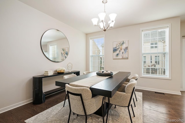 2855 Hardwick Rd, Ann Arbor, MI 48105 - dining room featuring dark wood finished floors and a chandelier