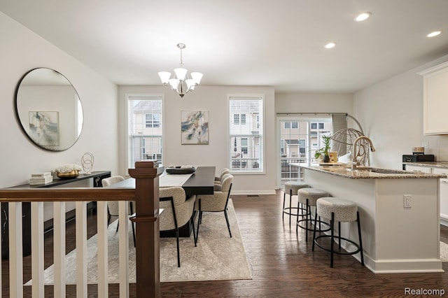 2855 Hardwick Rd, Ann Arbor, MI 48105 - dining area featuring plenty of natural light, a chandelier, recessed lighting, and dark wood-style floors