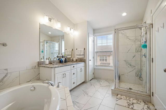 2855 Hardwick Rd, Ann Arbor, MI 48105 - full bathroom featuring double vanity, a shower stall, a bath, marble finish flooring, and recessed lighting