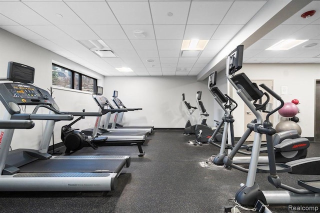 2855 Hardwick Rd, Ann Arbor, MI 48105 - exercise room featuring a drop ceiling and baseboards
