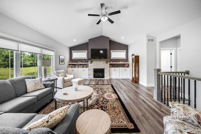 14170 Spring Valley Ct, Niles, MI 49120 - living room with wood finished floors, vaulted ceiling, ceiling fan, a stone fireplace, and recessed lighting