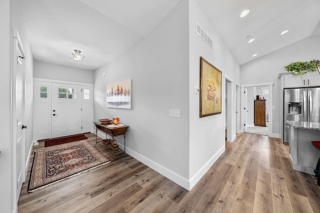 14170 Spring Valley Ct, Niles, MI 49120 - entryway with light wood-style flooring, lofted ceiling, and recessed lighting