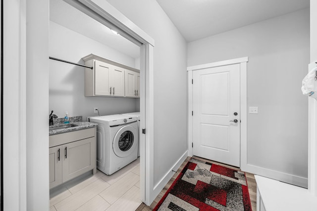 14170 Spring Valley Ct, Niles, MI 49120 - washroom with cabinet space, washer / dryer, and light wood-style flooring