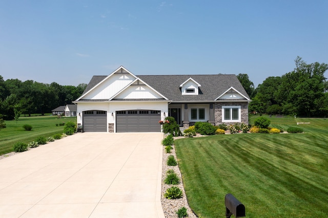 14170 Spring Valley Ct, Niles, MI 49120 - view of front of house featuring stone siding, driveway, a garage, and a front lawn