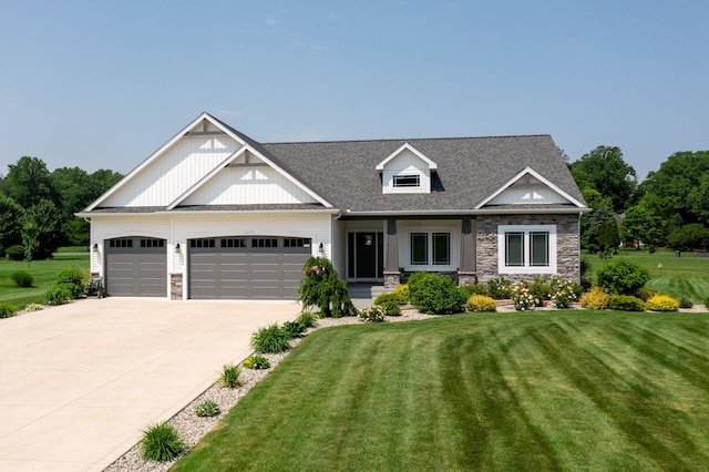 14170 Spring Valley Ct, Niles, MI 49120 - craftsman-style house featuring stone siding, a garage, a front yard, and driveway