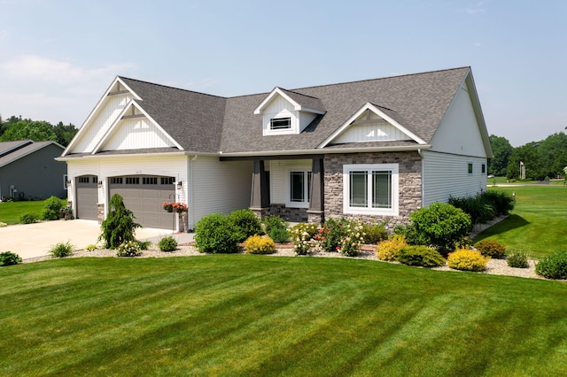 14170 Spring Valley Ct, Niles, MI 49120 - craftsman inspired home featuring a front lawn, a garage, concrete driveway, a shingled roof, and stone siding