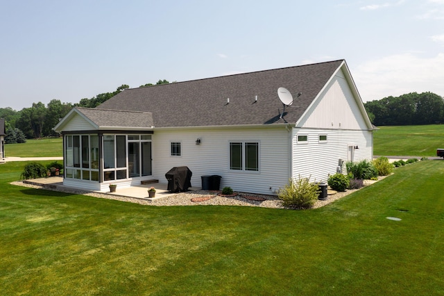 14170 Spring Valley Ct, Niles, MI 49120 - rear view of property featuring a sunroom, a yard, roof with shingles, and a patio