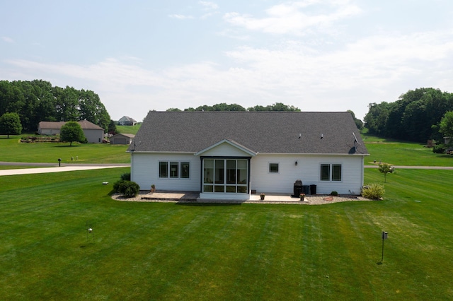 14170 Spring Valley Ct, Niles, MI 49120 - back of house featuring a patio area, a sunroom, and a lawn