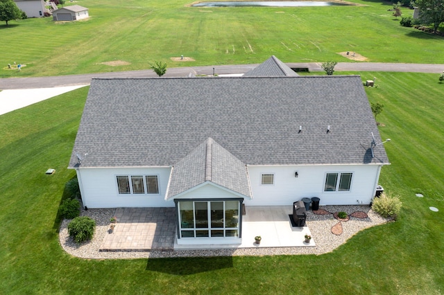 14170 Spring Valley Ct, Niles, MI 49120 - rear view of property featuring a patio area, a yard, and a shingled roof