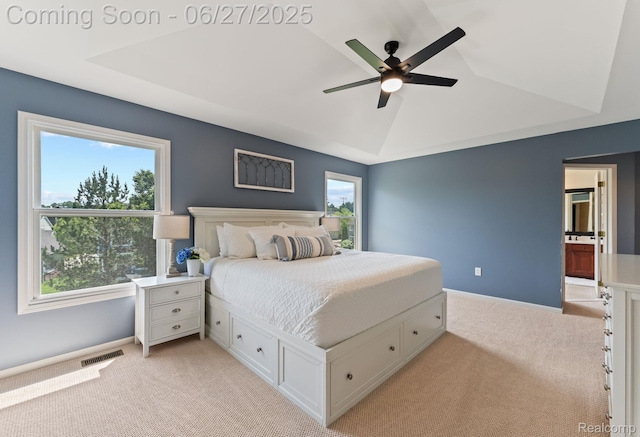 6060 Balmoral Way, Commerce Twp, MI 48382 - bedroom featuring light carpet, a tray ceiling, and ceiling fan
