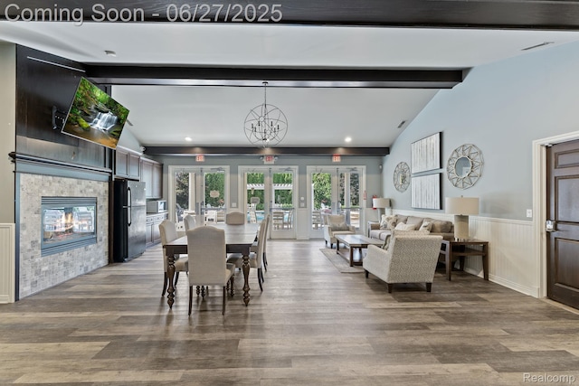 6060 Balmoral Way, Commerce Twp, MI 48382 - dining room with a wainscoted wall, french doors, wood finished floors, and a tiled fireplace