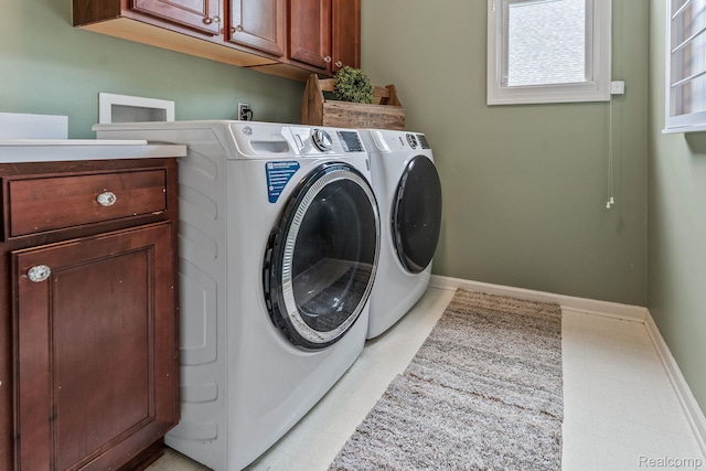6060 Balmoral Way, Commerce Twp, MI 48382 - laundry area with cabinet space and separate washer and dryer