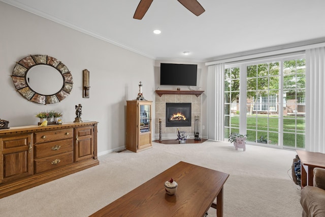 6733 Boulder Pointe Dr, Washington, MI 48094 - carpeted living room with ceiling fan, ornamental molding, a tiled fireplace, and recessed lighting