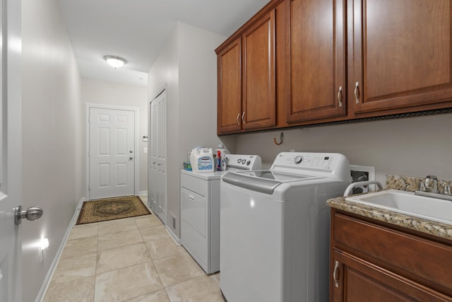 6733 Boulder Pointe Dr, Washington, MI 48094 - laundry area with cabinet space, washing machine and clothes dryer, and light tile patterned floors