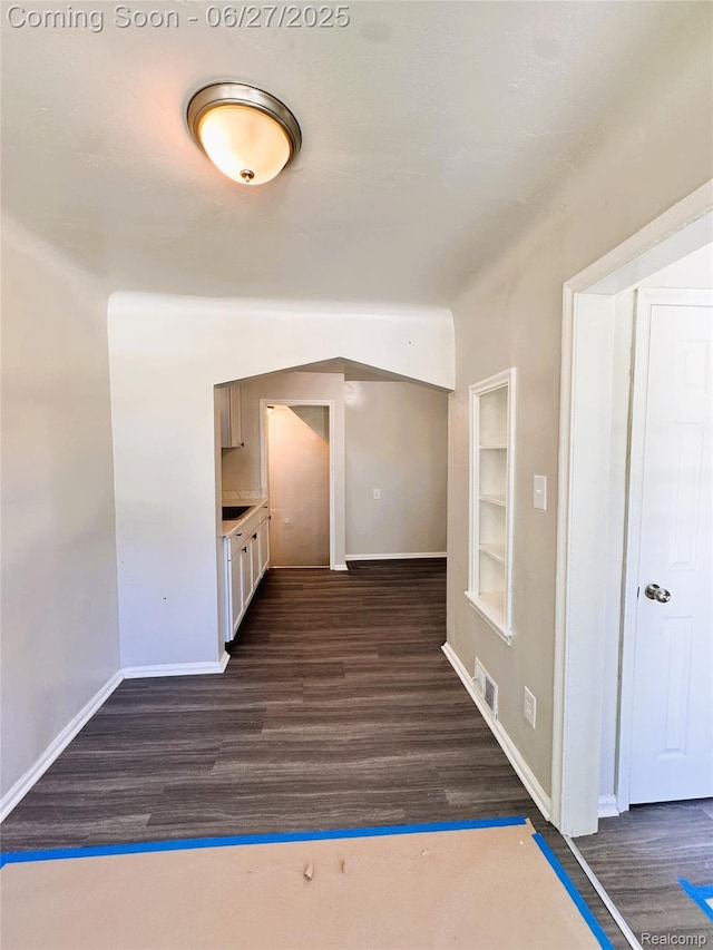 9646 Ward St, Dearborn, MI 48227 - unfurnished room featuring dark wood-style floors and built in features