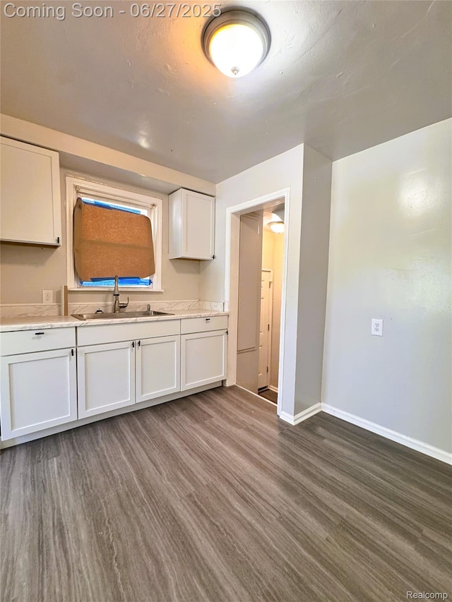 9646 Ward St, Dearborn, MI 48227 - kitchen with white cabinetry, light countertops, and dark wood-style flooring