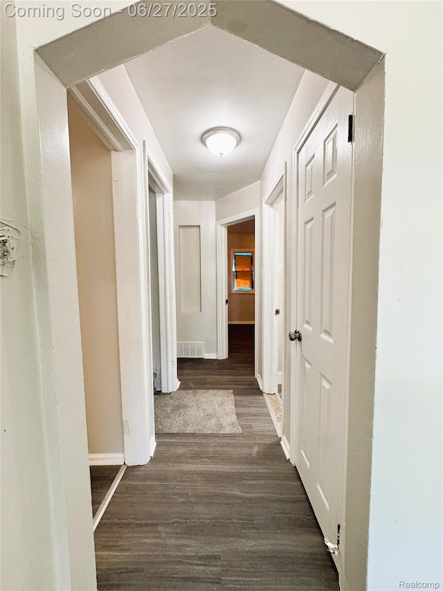 9646 Ward St, Dearborn, MI 48227 - hallway with dark wood-style floors and baseboards