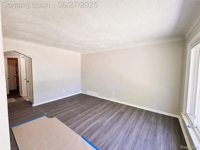 9646 Ward St, Dearborn, MI 48227 - unfurnished room with dark wood finished floors and a textured ceiling