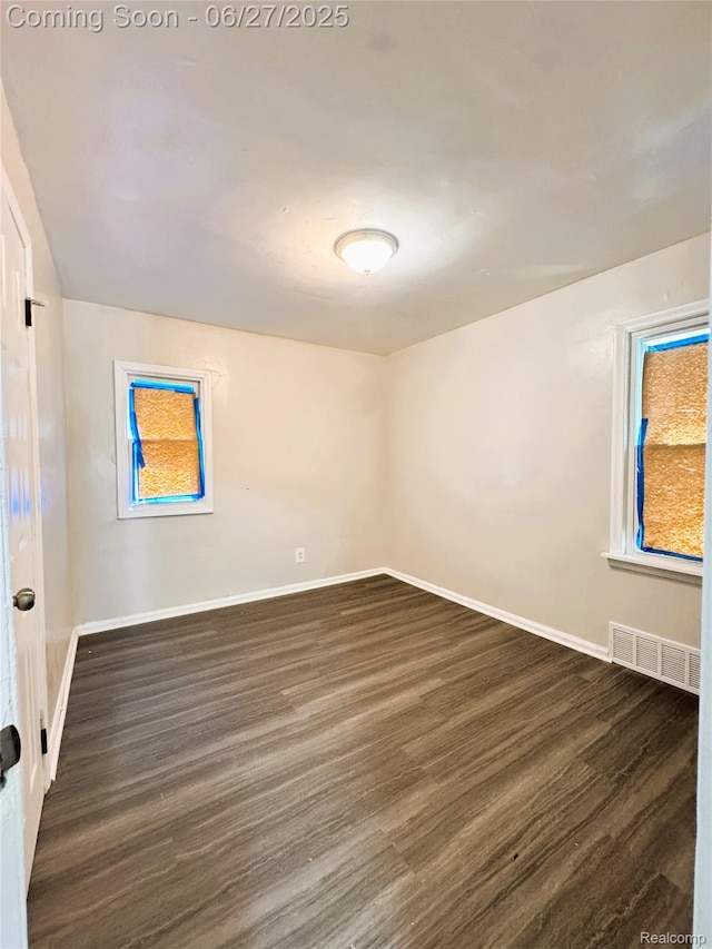 9646 Ward St, Dearborn, MI 48227 - spare room with dark wood-style flooring and baseboards