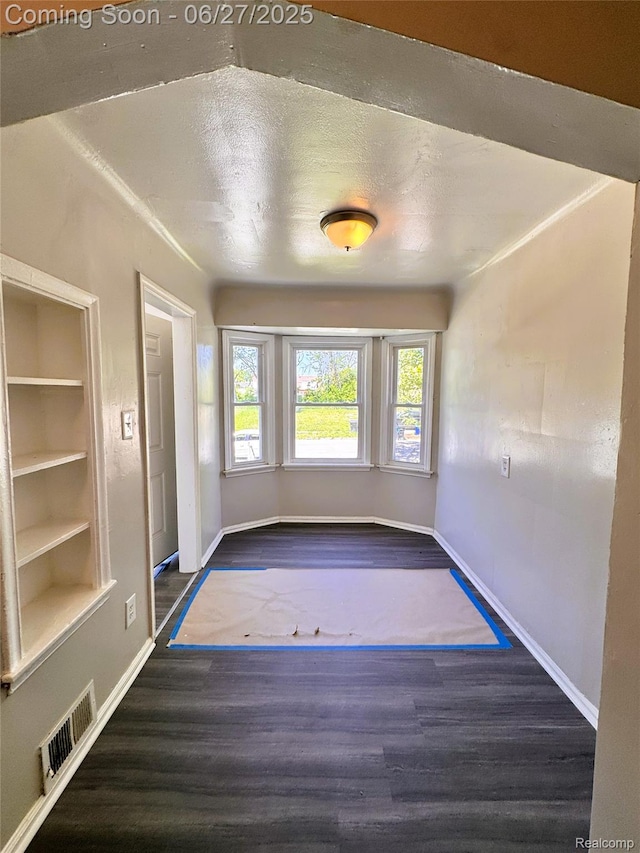 9646 Ward St, Dearborn, MI 48227 - empty room with wood finished floors and built in features