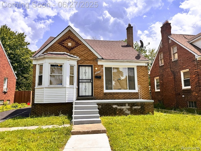 9646 Ward St, Dearborn, MI 48227 - bungalow-style home with brick siding and a shingled roof