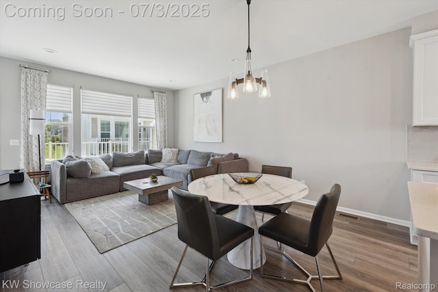 211 Monument Ln, Wixom, MI 48393 - dining space featuring wood finished floors
