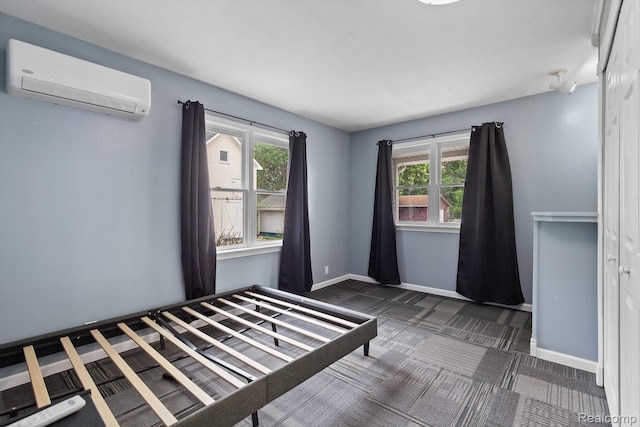 830 College Ave, Adrian, MI 49221 - unfurnished bedroom featuring a wall mounted AC and carpet flooring