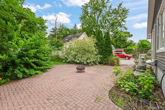 830 College Ave, Adrian, MI 49221 - view of patio / terrace with a fire pit
