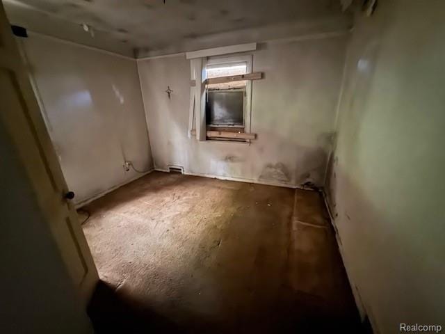 18460 Ferguson St, Detroit, MI 48235 - unfurnished room with unfinished concrete flooring