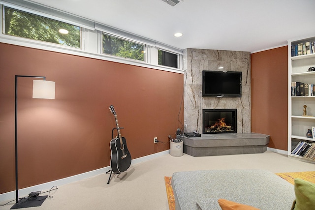 1917 Benjamin Ave, Kalamazoo, MI 49008 - carpeted living area featuring a tile fireplace and baseboards