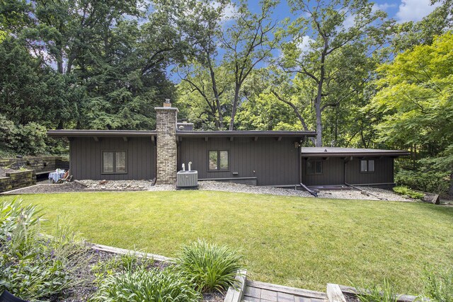 1917 Benjamin Ave, Kalamazoo, MI 49008 - back of house featuring a yard and a chimney