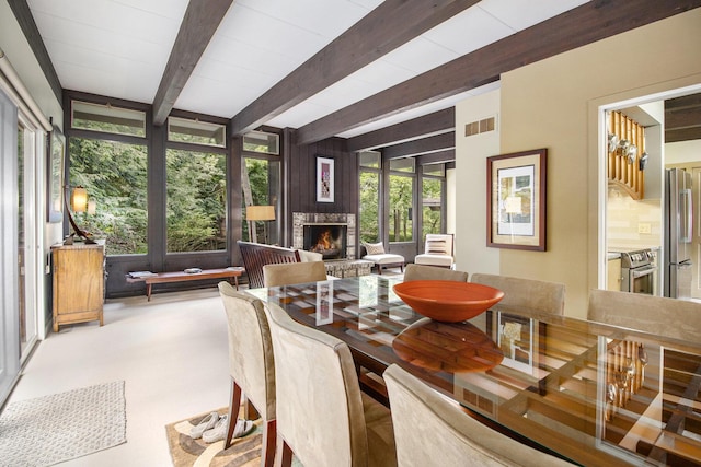 1917 Benjamin Ave, Kalamazoo, MI 49008 - dining room with beamed ceiling and a lit fireplace