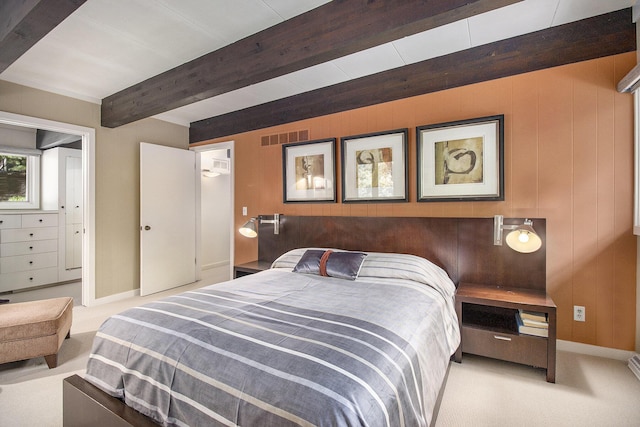1917 Benjamin Ave, Kalamazoo, MI 49008 - bedroom with beam ceiling, carpet flooring, wood walls, and baseboard heating