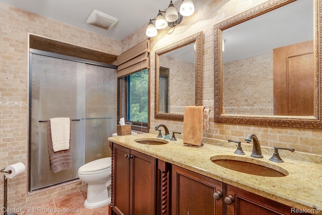 9601 Kier Rd, Holly, MI 48442 - full bathroom with double vanity, a stall shower, tile walls, and tile patterned flooring