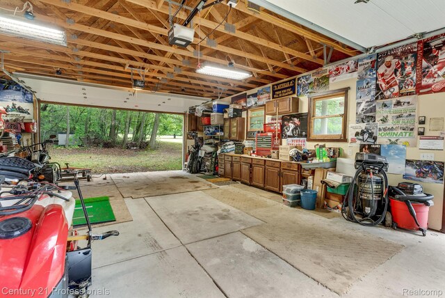 9601 Kier Rd, Holly, MI 48442 - garage with a garage door opener