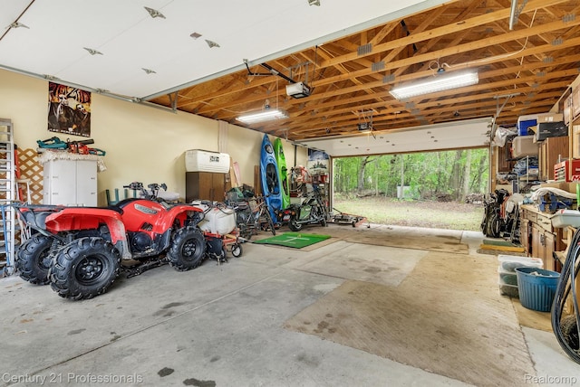 9601 Kier Rd, Holly, MI 48442 - garage with a garage door opener