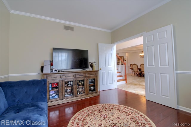 761 Nissen Ct, Wixom, MI 48393 - living area featuring ornamental molding, a chandelier, wood finished floors, and stairway