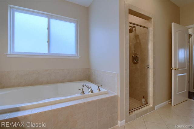 761 Nissen Ct, Wixom, MI 48393 - full bath featuring a garden tub, a shower stall, and tile patterned flooring