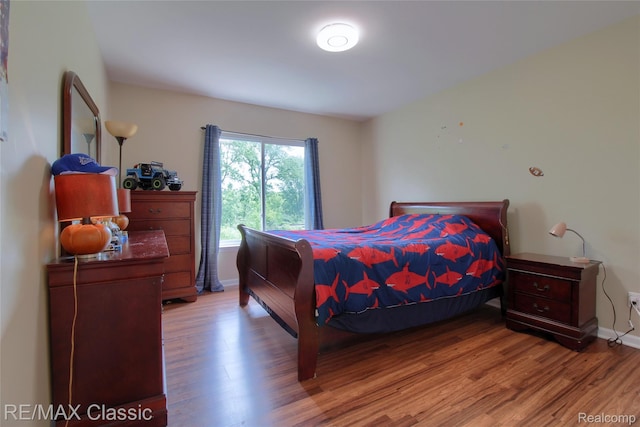 761 Nissen Ct, Wixom, MI 48393 - bedroom featuring wood finished floors and baseboards