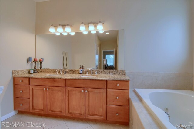 761 Nissen Ct, Wixom, MI 48393 - bathroom with double vanity, a tub with jets, and tile patterned flooring