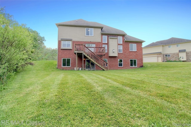 761 Nissen Ct, Wixom, MI 48393 - rear view of house with stairway, a wooden deck, a yard, and brick siding
