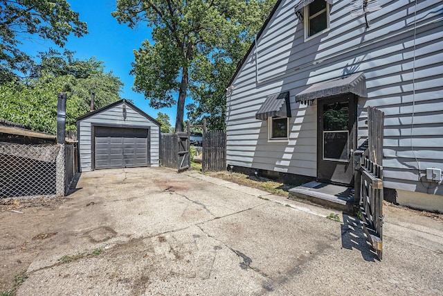 237 Holly St, Wyoming, MI 49548 - view of property exterior featuring an outbuilding, a garage, and driveway