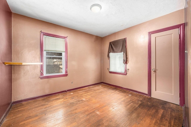 237 Holly St, Wyoming, MI 49548 - unfurnished room with hardwood / wood-style flooring