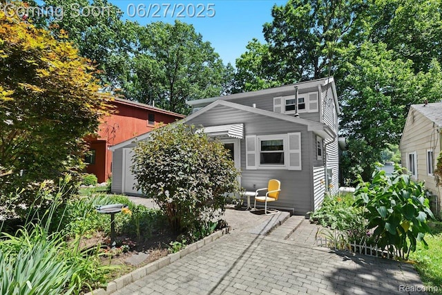 1500 Clark Lake Rd, Brighton, MI 48114 - view of front of house featuring a patio area